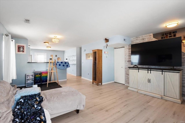 living room with light hardwood / wood-style flooring