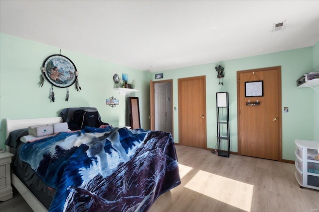 bedroom featuring light wood-type flooring