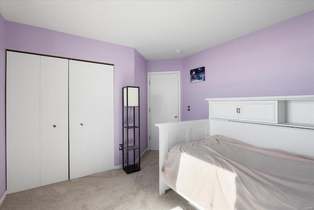 carpeted bedroom with a closet