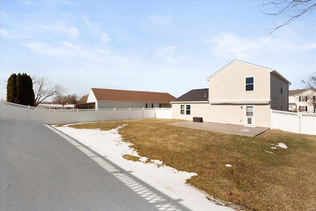 view of front facade with a patio and a front lawn