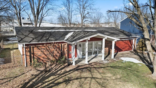 rear view of property with a yard