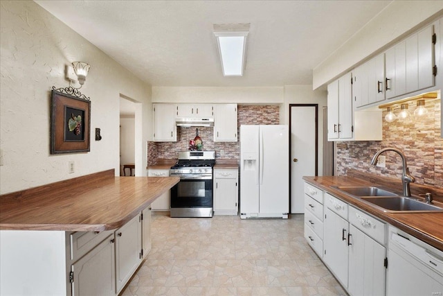 kitchen featuring white cabinetry, sink, and white appliances