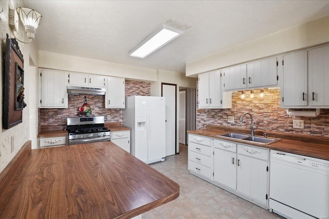 kitchen featuring sink, white appliances, tasteful backsplash, white cabinets, and wood counters