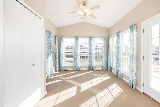 unfurnished sunroom featuring lofted ceiling and ceiling fan