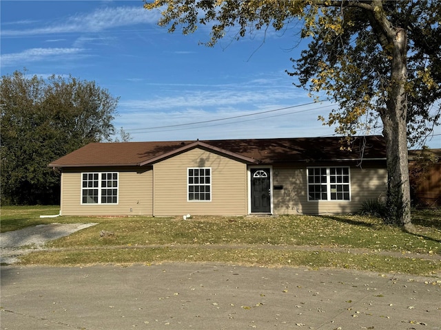 ranch-style house with a front yard