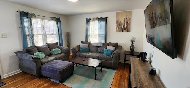 living room with dark hardwood / wood-style flooring