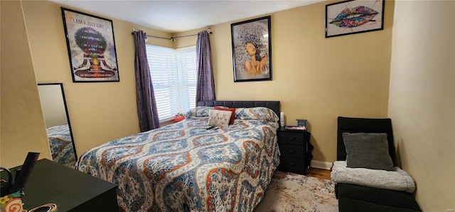 bedroom with light hardwood / wood-style flooring