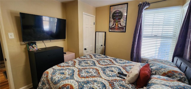 bedroom featuring multiple windows