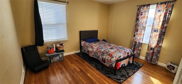 bedroom with hardwood / wood-style floors