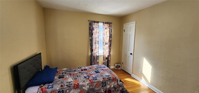 bedroom with light hardwood / wood-style floors