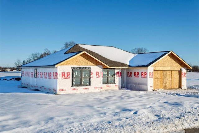 unfinished property featuring a garage