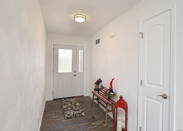 doorway with dark hardwood / wood-style floors