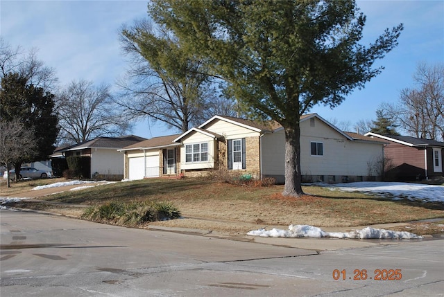 ranch-style house featuring a garage