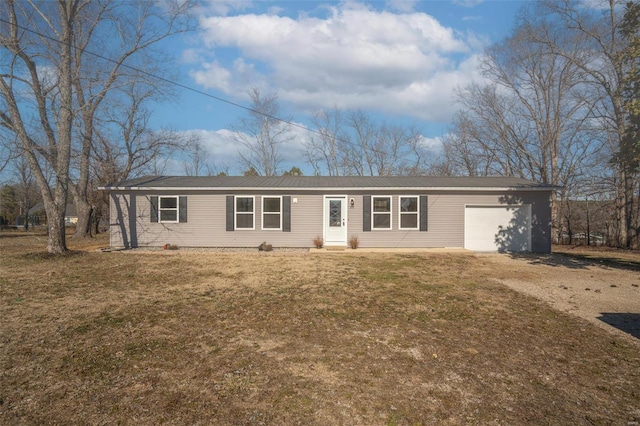 ranch-style home with a garage and a front yard