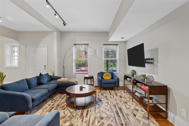 living room featuring track lighting and wood-type flooring