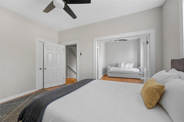 bedroom with hardwood / wood-style flooring and ceiling fan