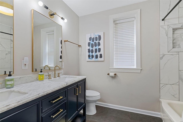 full bathroom featuring vanity, tiled shower / bath combo, and toilet