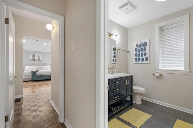 bathroom with vanity and toilet