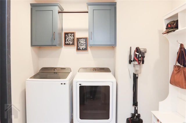 laundry room featuring cabinet space and separate washer and dryer