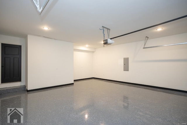 garage featuring electric panel, baseboards, and a garage door opener