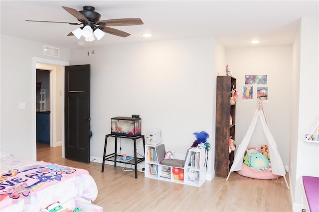 bedroom with ceiling fan, wood finished floors, visible vents, and recessed lighting