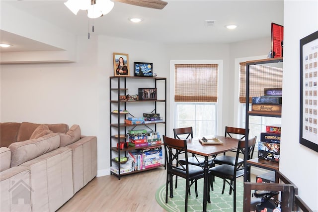 dining room featuring light wood finished floors, recessed lighting, visible vents, a ceiling fan, and baseboards