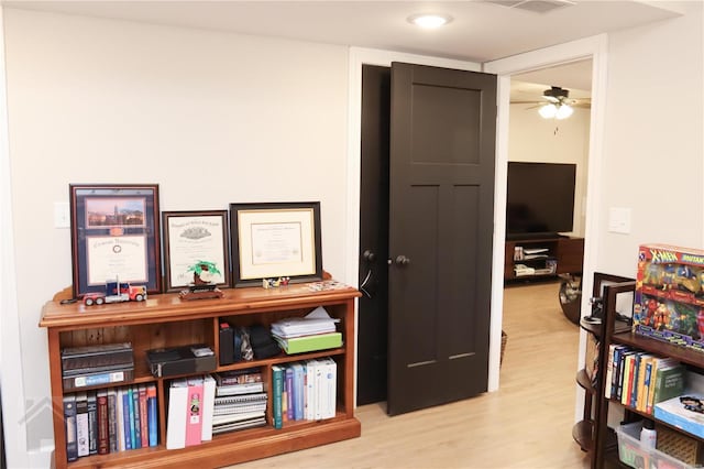 interior space with visible vents, wood finished floors, and a ceiling fan