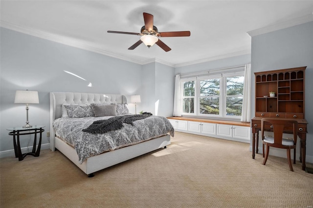 carpeted bedroom with crown molding and ceiling fan