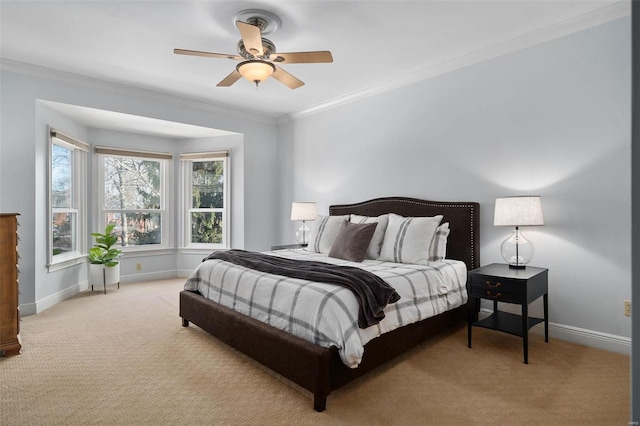 bedroom featuring crown molding, ceiling fan, and light carpet