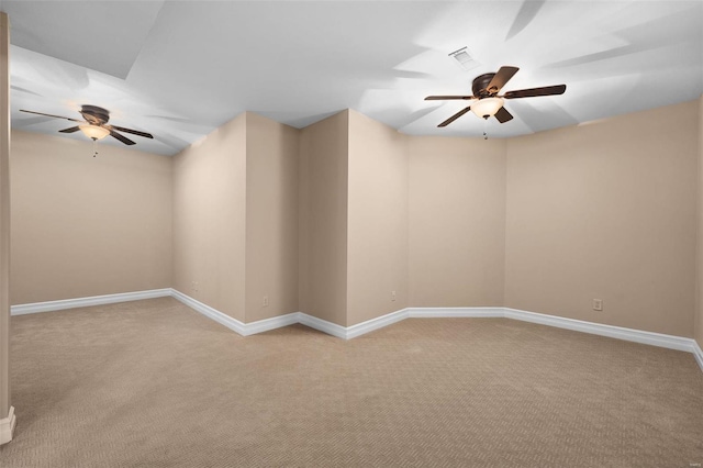 carpeted empty room featuring ceiling fan