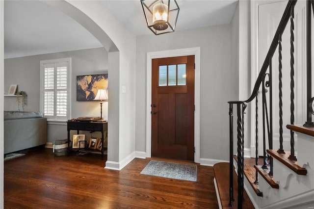 entryway with dark hardwood / wood-style floors