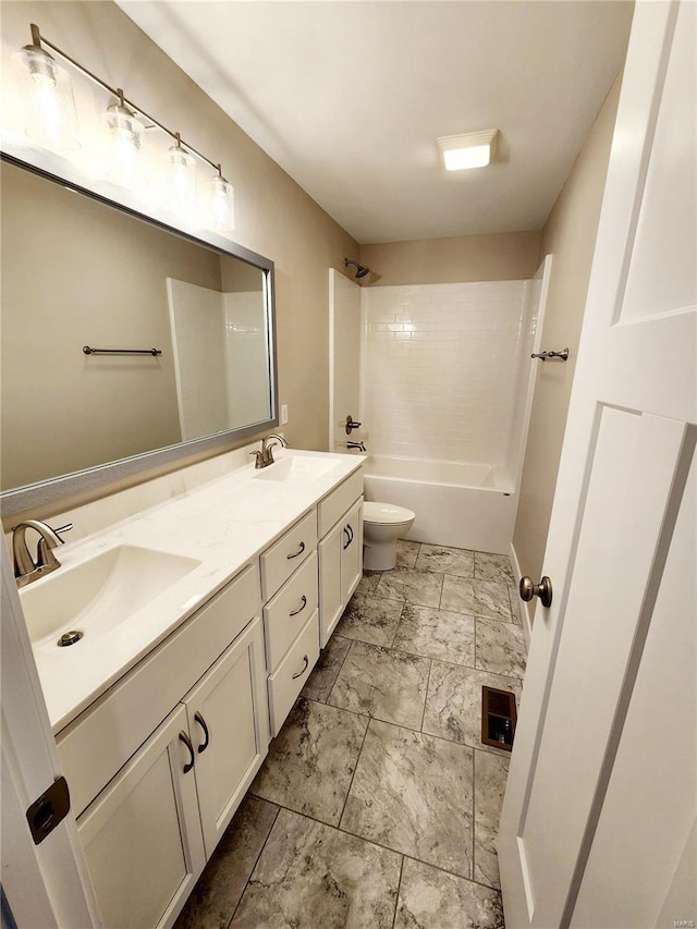 full bathroom with tiled shower / bath combo, vanity, and toilet