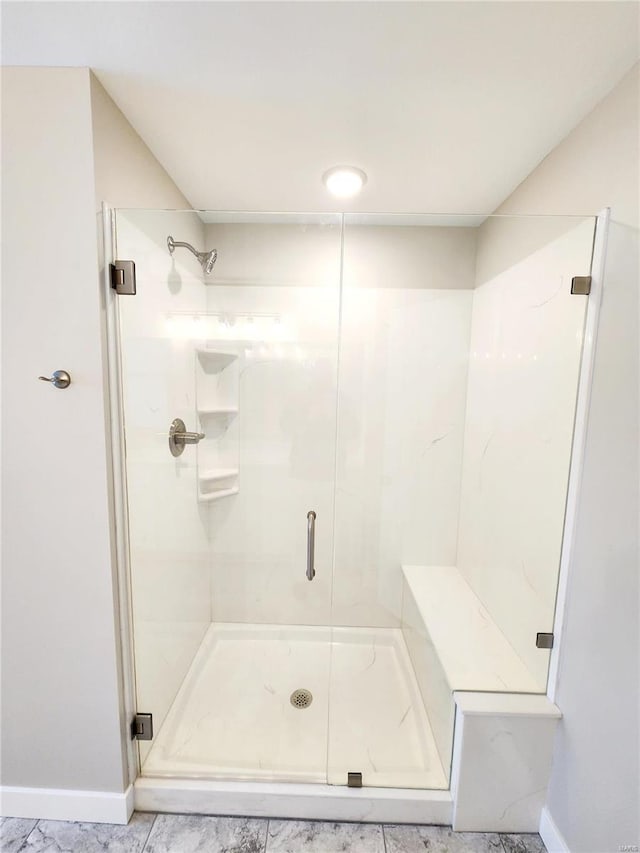 bathroom featuring tile patterned floors and a shower with door