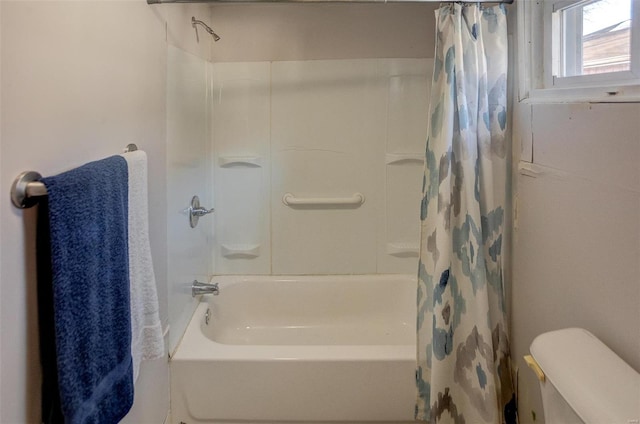 bathroom with shower / tub combo and toilet