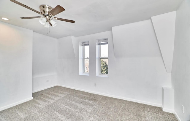 carpeted empty room with ceiling fan