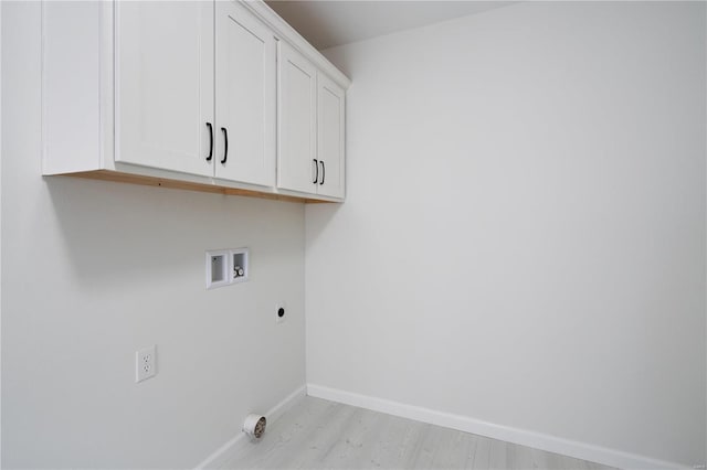 laundry area with cabinets, washer hookup, hookup for an electric dryer, and light hardwood / wood-style floors