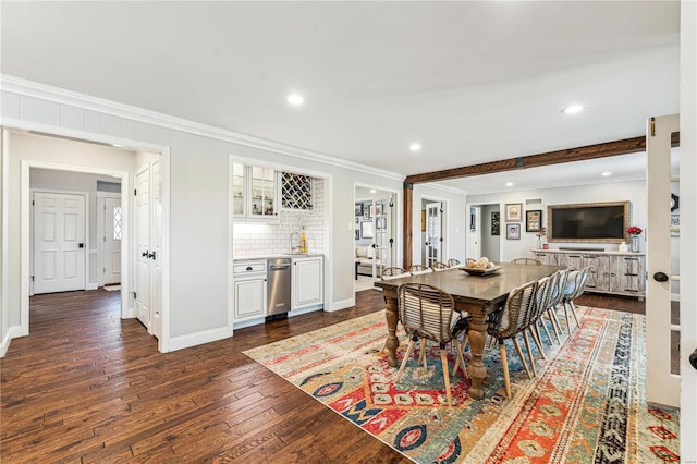 dining space with baseboards, ornamental molding, dark wood-type flooring, and recessed lighting