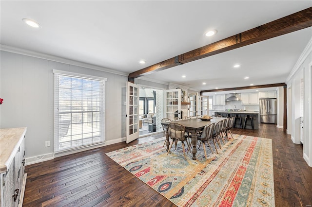 dining room featuring baseboards, beam ceiling, ornamental molding, and dark wood-type flooring