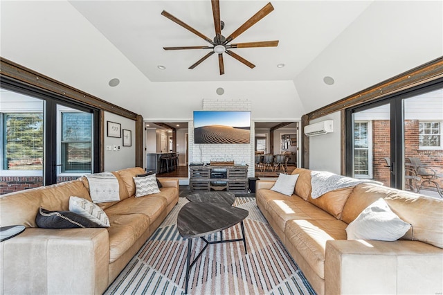 living area with a wall unit AC and a ceiling fan