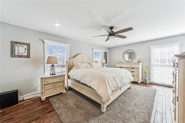 bedroom with recessed lighting, dark wood finished floors, baseboards, and ceiling fan