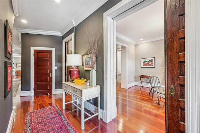 hall with crown molding and wood-type flooring