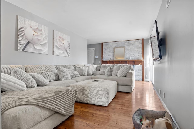 living room featuring baseboards and wood finished floors