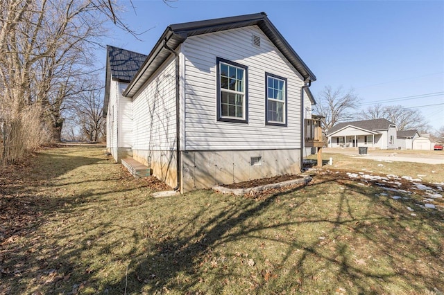 view of property exterior with a lawn