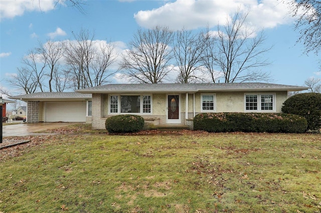 single story home featuring a garage and a front lawn