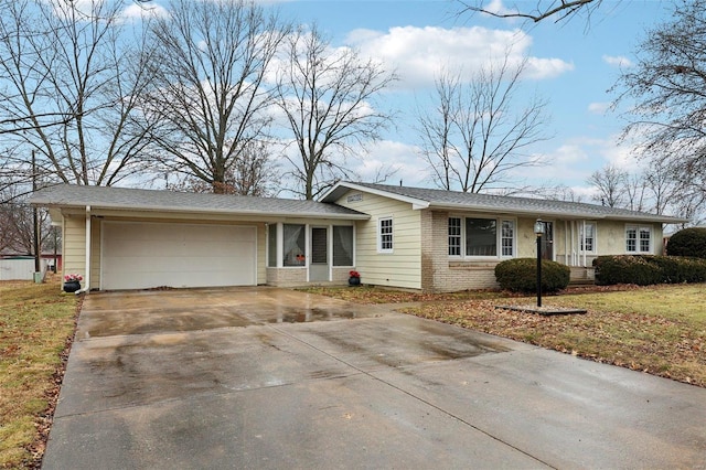 ranch-style house with a garage and a front yard