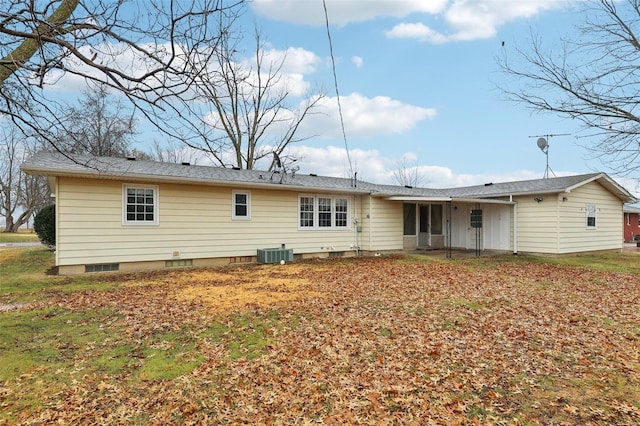 rear view of property with central AC unit