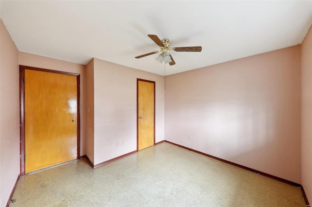 unfurnished bedroom featuring ceiling fan and a closet