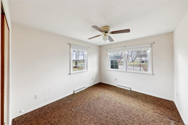 spare room with carpet floors and ceiling fan