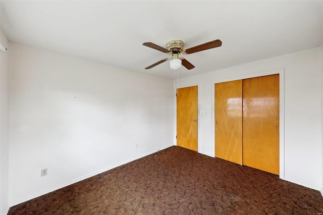 unfurnished bedroom with carpet, ceiling fan, and a closet