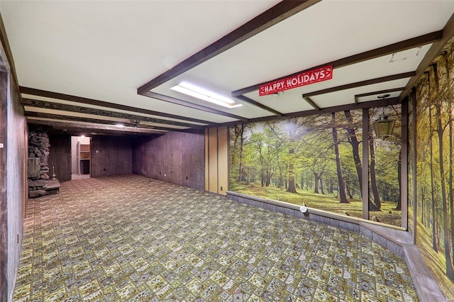 basement featuring wooden walls